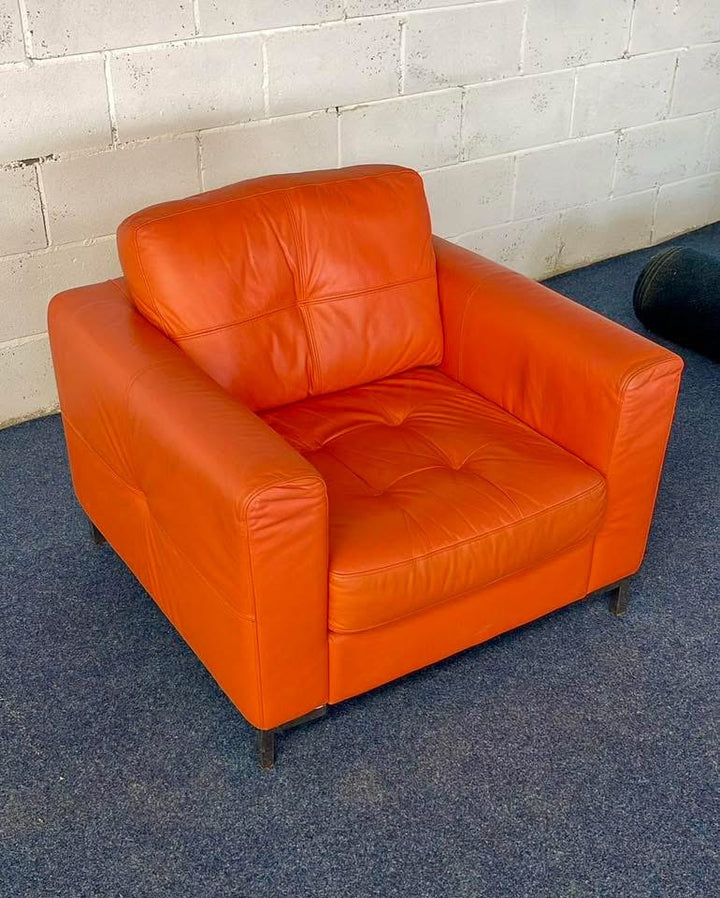 1970s inspired bright orange leather sofa & chair
