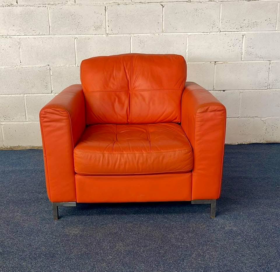 1970s inspired bright orange leather sofa & chair