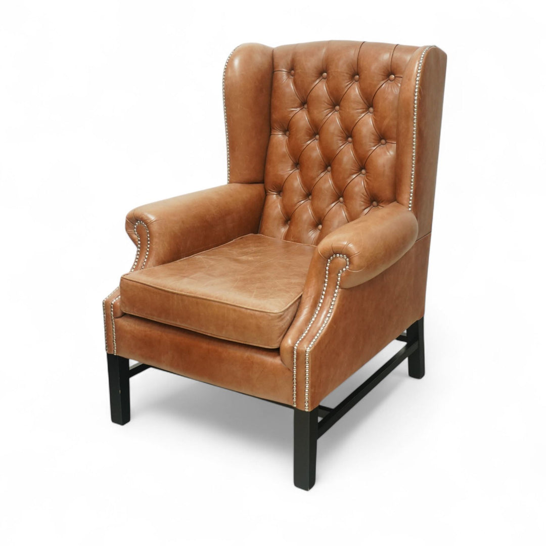 Stylish pair of leather wingback chairs